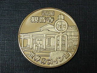 ���E�̃R�C����